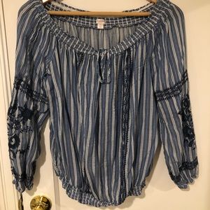 Blue long sleeved shirt.